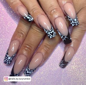 Halloween Black And White Acrylic Nails With Spider Web French Tips Over Pink Glittery Surface