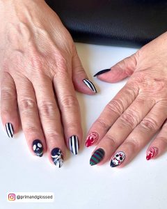 Halloween Black And White Nail Art For Short Nails Wit, Ghost Art, Green And Red Stripes And Bloody Skull Design Over White Surface