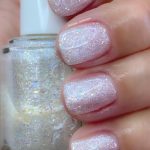 Hand With Rounded White Glitter Nails, Holding Nail Polish Bottle