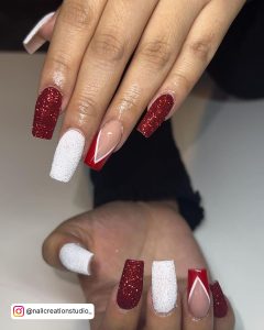 Hands With Red And White Glitter Nails For Christmas Evening