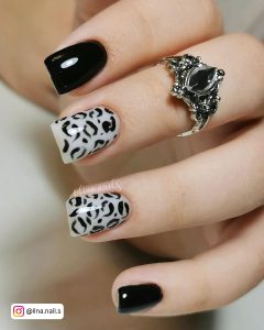 Leopard-Print Black And White Nails With Glossy Plain Black.