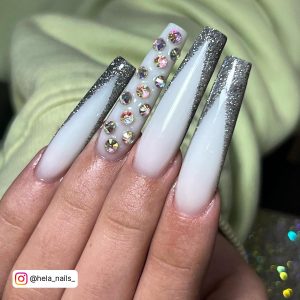 Long Milky White Ballerina Nails With Silver Glitter Tips And Large Rhinestones