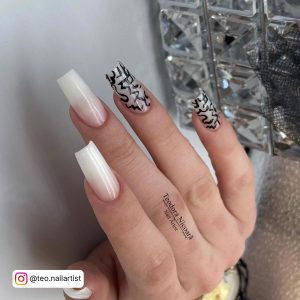 Long Milky White Coffin Nails With Abstract Black Design On Two Nails
