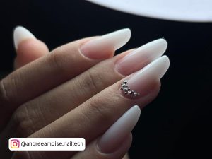 Long Oval Milky White Nails With Silver Cuticle Gems