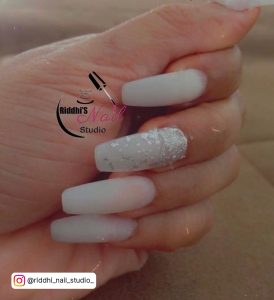 Long Snowy White Glitter Nails With Monogram Of Riddhi'S Nail Studio