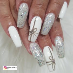Long Square Tip White And Silver Glitter Nails With Silver Bow Design