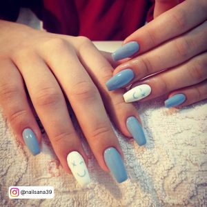 Lovely Torquoise Blue And White Smiley Nails Over White Towel