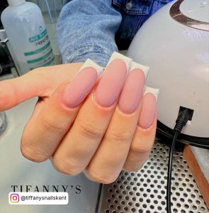 Matte Nude Nails With White Tips With Nail Dryer In Background.