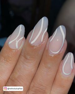 Milky White Almond Nails With White Swirl Design