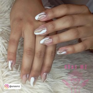 Nude And White Nails On A Mat