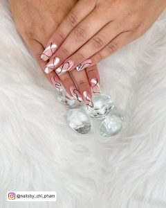 Nude, Black, And White Abstract Nails Over Gems And White Fur