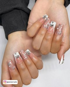 Nude Coffin Nails With White French Tip, Pearls, Silver Tribal Designs And Silver Decorations