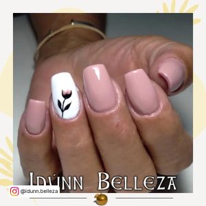 Nude Nails With White Flowers On One Finger