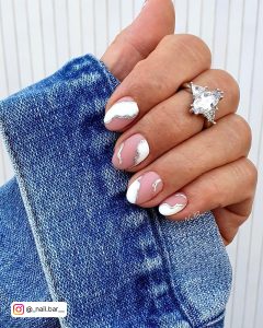 Nude Short Round Tip Nails With White And Silver Wavy Designs