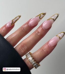 Nude Stiletto Acrylic Nails With Foggy White And Gold Tips And A White Diamond And Gold Ring
