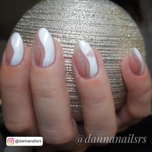 Nude To White Nails Holding A Golden Ball