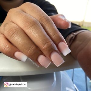 Nude White Ombre Nails On A Table