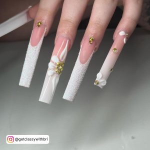Ombre White Glitter Nails With Gold Rhinestones On White Shelf