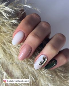 Oval Milky White Nails With A Nude Nail, A Milky White Nail With Gold Foil And A Black Nail With Gold Foil