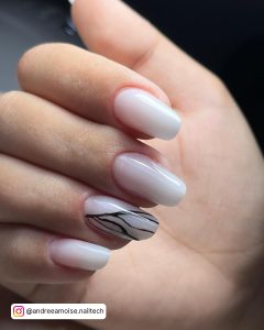 Oval Milky White Nails With Black Butterfly Wing Design On The Feature Nail