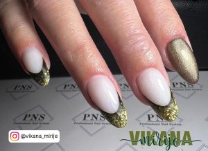 Oval Shaped White Glitter Nails With Chrome Tips Over Pns Salon Desk