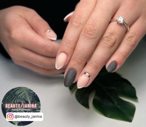 Perfect Matte Black And White Nails With Simple Double French Tips, Black Glitters And Stones On Wihite Surface With Leaf
