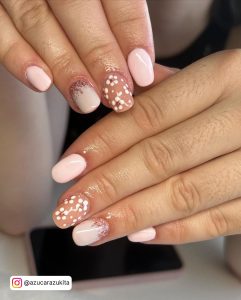 Pink And White Almond Nails With One Finger In Brown