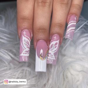 Pink And White French Tip Nails With Diamonds