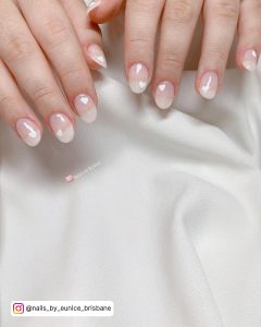 Pink And White Heart Nails On A Silk Sheet