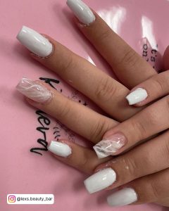Pink And White Marble Nails On A Pink Table