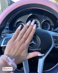 Pink And White Nail Designs In Front Of A Steering Wheel