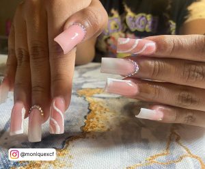 Pink And White Nails With Diamonds And Swirls