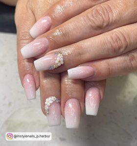 Pink And White Ombre Nails With Diamonds On Ring Finger