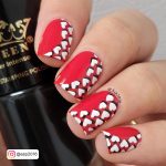 Red Nails With White Hearts For Date Night