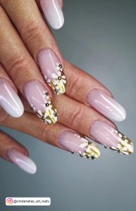 Round Pin And White Ombre Nails With Gold Tips And White Flowers
