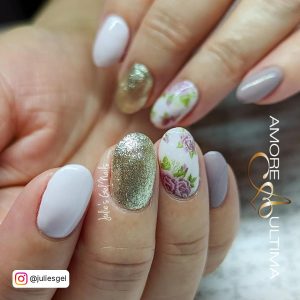 Round White Nails With Gold Glitter And Purple Flowers