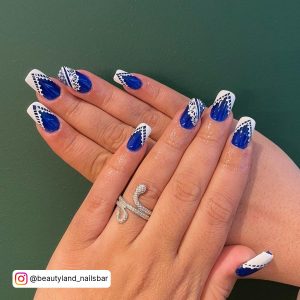 Royal Bblue With White Tips Nails On Green Background