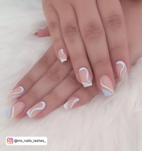 Sexy Squiggle Blue And White French Tip Naills On White Fur Clothe