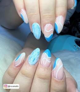 Short Abstract Nude, Blue, And White Nails On White Fur