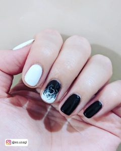 Short Black And Ehite Gel Nails With White Fiery Design