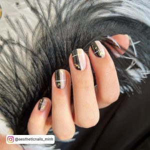 Short Black White, And Gold Nails Over Black Feathers