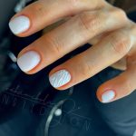 Short Milky White Nails With Textured Effect On One Of The Nails