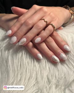 Short Off White Acrylic Nails With Golden Leave Design Over Fur Clothe