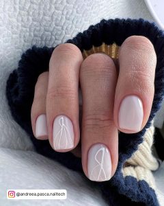 Short Square Tip Milky White Nails With White Line Pattern On Two Finger Nails