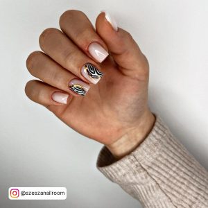 Short Square Tip Milky White Nails With Zebra Pattern On Two Feature Nails