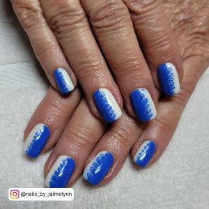 Short White Nails With Blue Design On White Surface