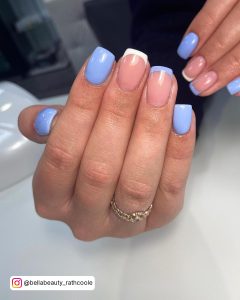 Simple Blue And White French Nails With Plain Blue Polish Over White Background