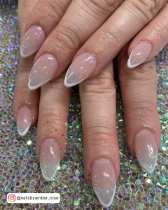 Simple Clear Nails With White Tips On Glittery Surface