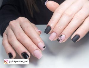Simple Mickey Mouse Black And White Square Nails With Matte And Glossy Black Coats Over A White Surface