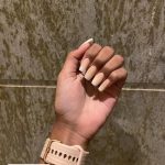 Simple Nude And White Ombré Acrylic Nails Over Marble Surface